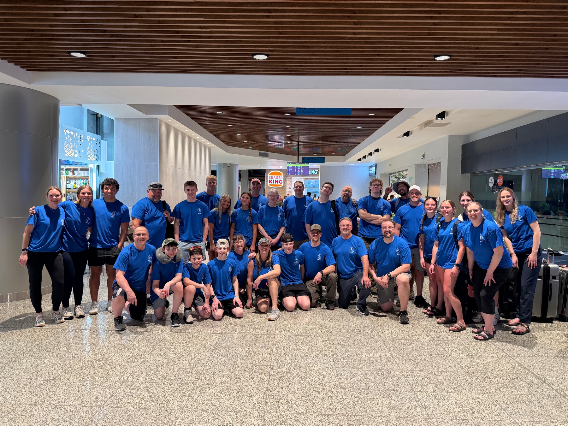 Large volunteer team arriving together at the airport