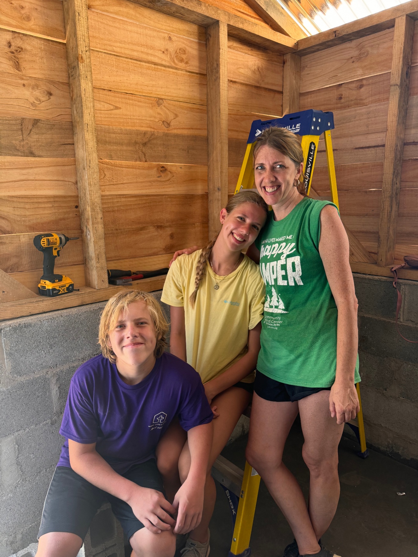 Volunteers taking a break inside a home under construction