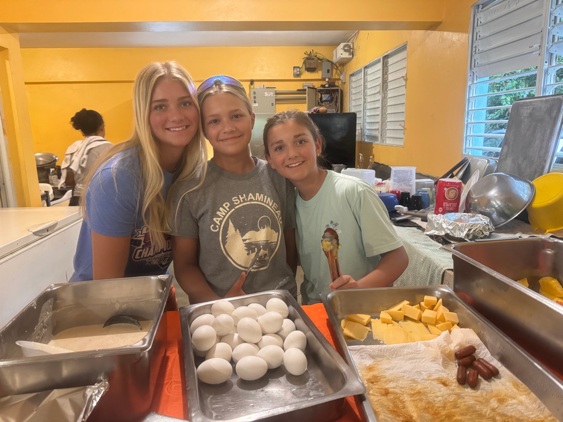 Volunteers preparing breakfast in the kitchen